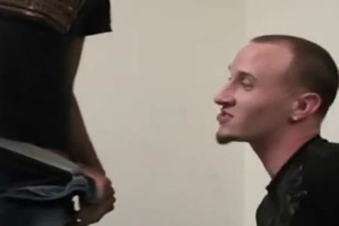dark chap acquires his penis wet by a white chap
